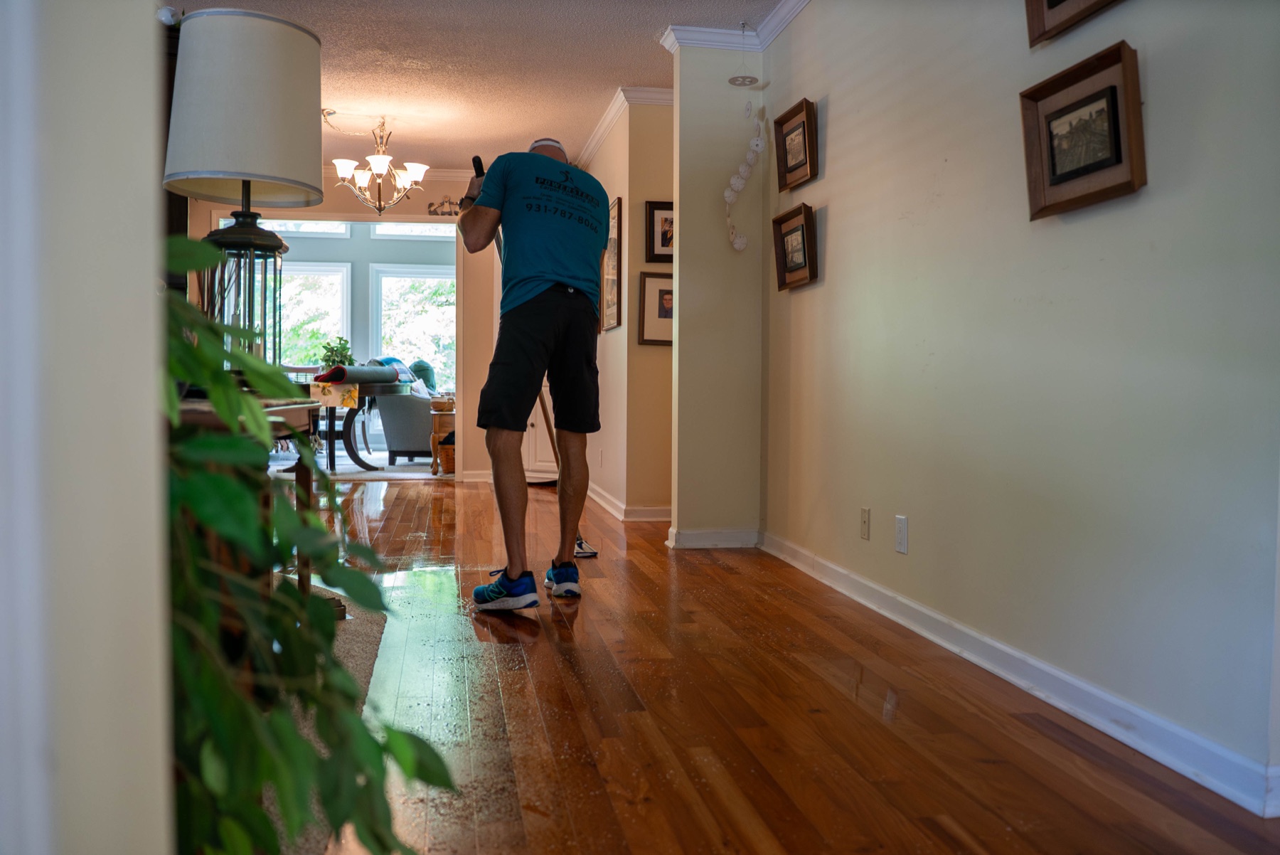 PowerSteam technician cleaning a hardwood floor